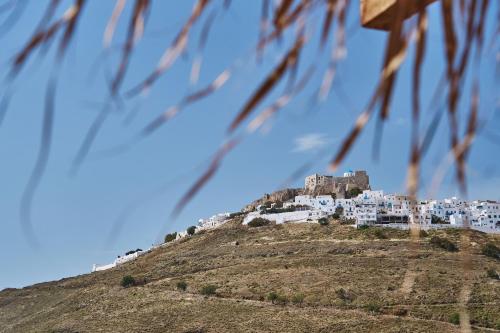 a village on top of a hill at Chrysalis Boutique - Adults Only in Astypalaia Town
