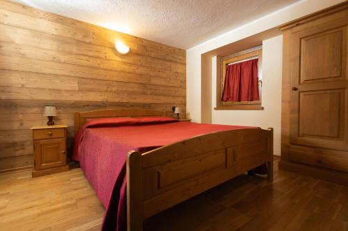 Giường trong phòng chung tại Maison Godioz - Appartamento 4