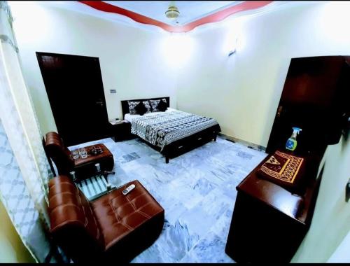 Katil atau katil-katil dalam bilik di Galaxy Inn - Near Jinnah International Airport Branch