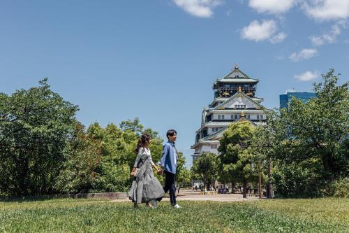 a couple walking in front of the eiffel tower at Centara Grand Hotel Osaka in Osaka