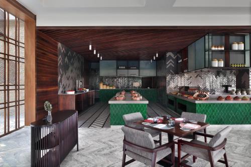 a rendering of a kitchen with a table and chairs at The Westin Goa in Vagator