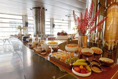 a buffet line with many different types of food at DuoMo Hotel in Rimini