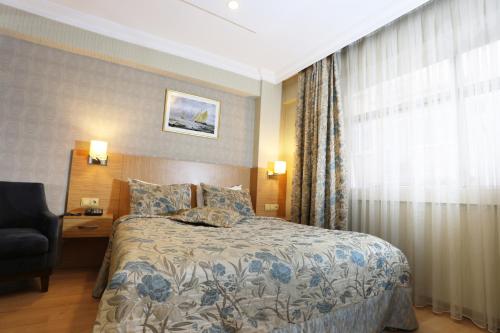 Cama o camas de una habitación en Riva Hotel Alsancak