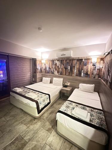 Postel nebo postele na pokoji v ubytování Street61 Apart Hotel