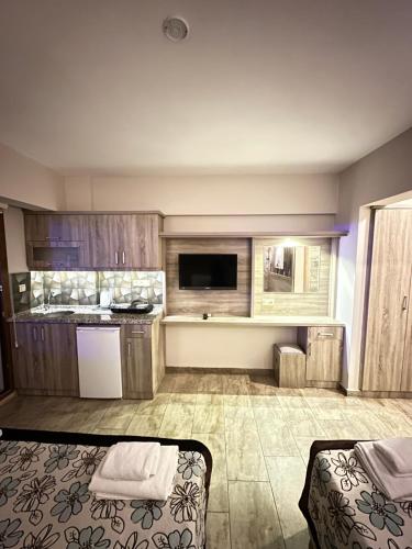 a large room with a kitchen and a living room at Street61 Apart Hotel in Sarigerme