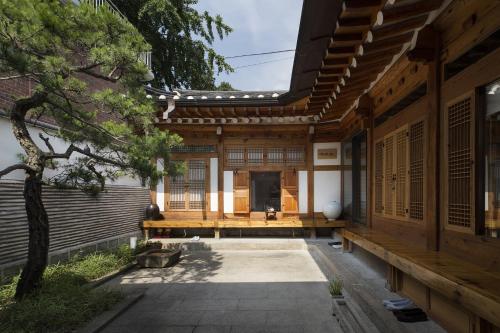 an external view of a house with a courtyard at Renewal Open!!! Entire Place, Traditional Stay Xiwoo , 時雨 시우 한옥독채 in Seoul