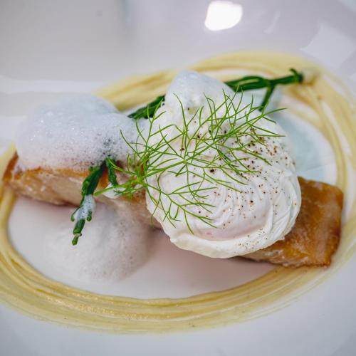 a plate of food with dumplings on top at The Salutation Inn in Topsham