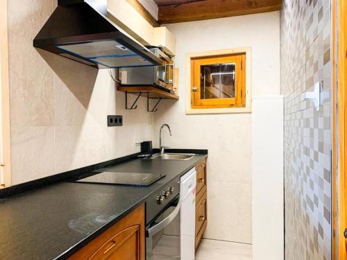 a kitchen with a sink and a stove at Magic Borda Puntal HUT 7983 in Ordino
