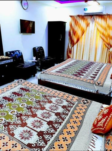 Katil atau katil-katil dalam bilik di Galaxy Inn - Near Jinnah International Airport Branch