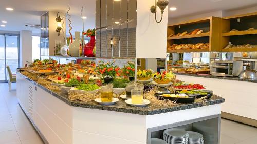 a buffet with a lot of food on a counter at Best Western Plus Khan Hotel in Antalya