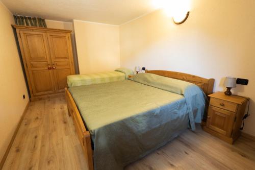 Una cama o camas en una habitación de Maison Godioz - Appartamento 2