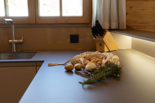 a kitchen counter with a bunch of mushrooms on it at Chalet Zuestoll in Wildhaus