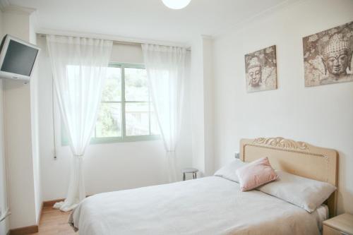 Posteľ alebo postele v izbe v ubytovaní Apartamento Grañamar Grove