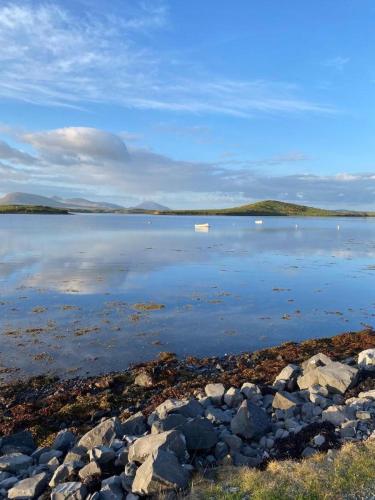 a large body of water with a boat in it at Seapoint Lodge in Westport