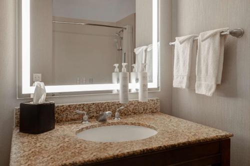 a bathroom with a sink and a mirror at Hampton Inn & Suites San Luis Obispo in San Luis Obispo