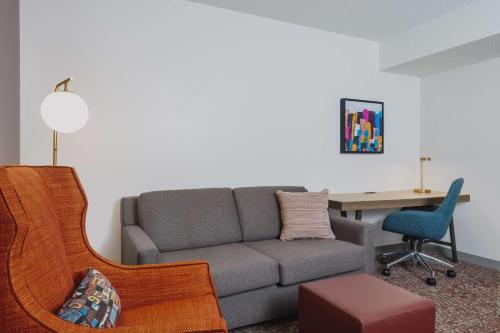 a living room with a couch and a table at Hilton Garden Inn Montgomery East in Montgomery