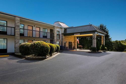 a hotel building with a parking lot in front of it at Quality Inn Commerce at I-85 in Commerce