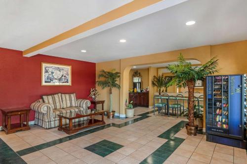 a lobby with a couch and chairs and a table at Econo Lodge Union City - Atlanta South in Union City