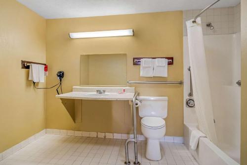 a bathroom with a toilet and a sink and a shower at Econo Lodge Union City - Atlanta South in Union City
