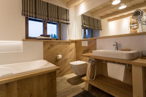 a bathroom with a sink and a toilet at Aparthotel Bambi in Zakopane