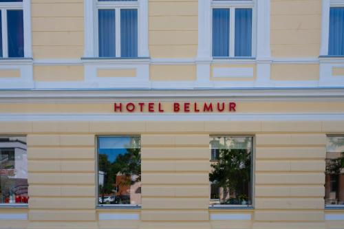 a hotel beaumont sign on the side of a building at Hotel Belmur in Murska Sobota