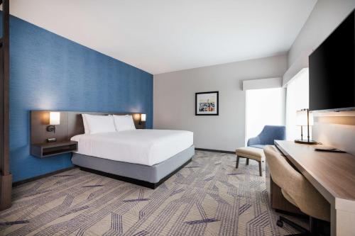 a hotel room with a bed and a desk at Hyatt Place San Carlos in San Carlos