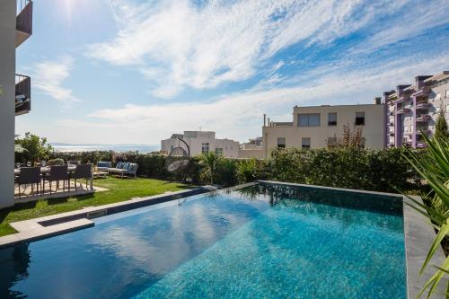 New luxury apartment with PRIVATE Heated POOL and amazing terrace with seaview