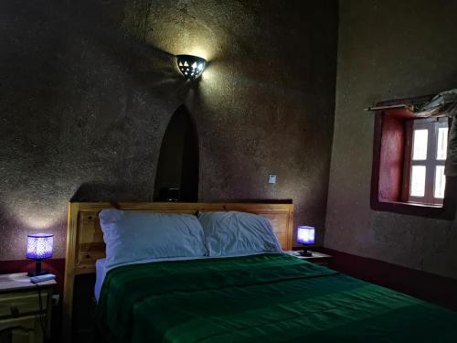 Ein Bett oder Betten in einem Zimmer der Unterkunft Riad Dar Zaouia