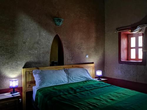 Ein Bett oder Betten in einem Zimmer der Unterkunft Riad Dar Zaouia