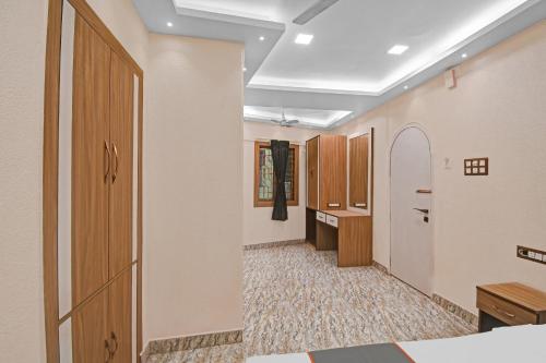 a corridor of a hospital room with a door and a hallway at Flagship Prithvi Residency in New Delhi