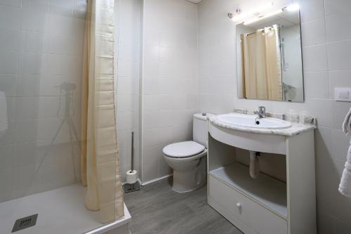 a bathroom with a sink and a toilet and a shower at Hotel H28 Camas in Camas