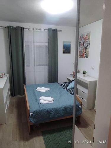 Ένα ή περισσότερα κρεβάτια σε δωμάτιο στο Nina