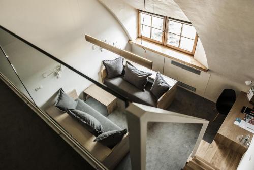 a living room with a couch and a window at HOT_elarnia Hotel & Spa in Puszczykowo