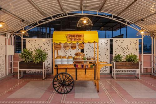a food cart with a fruit stand at Ganga Lahari by Leisure Hotels in Haridwār
