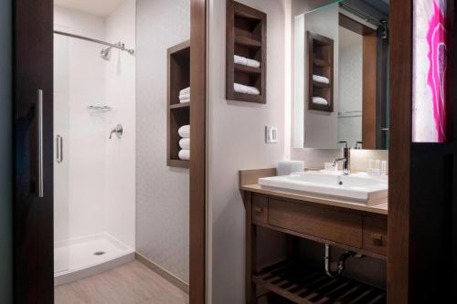 a bathroom with a sink and a shower at Residence Inn by Marriott Phoenix Downtown in Phoenix