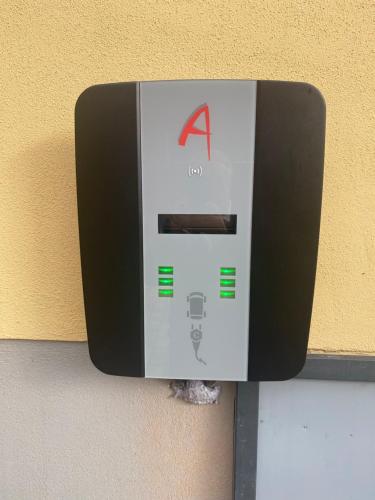 a paper towel dispenser on the side of a wall at Hotel-Gasthof Zur Post in Velburg