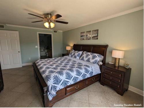 a bedroom with a bed and a ceiling fan at Biloxi Beach-Good Vibes Condo in Biloxi