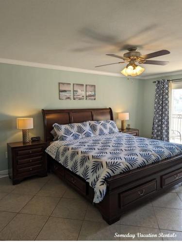 a bedroom with a bed and a ceiling fan at Biloxi Beach-Good Vibes Condo in Biloxi