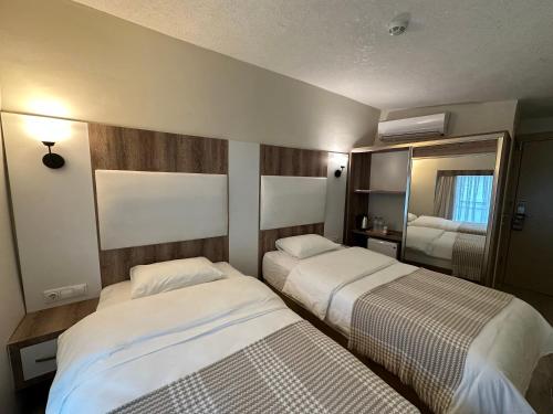 Ένα ή περισσότερα κρεβάτια σε δωμάτιο στο Line Suite Hotel