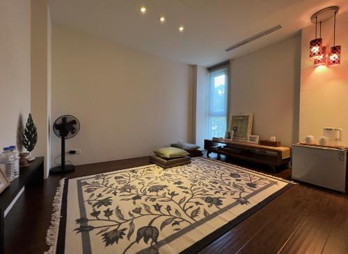 a living room with a rug on the floor at Shu Sia in Hengchun