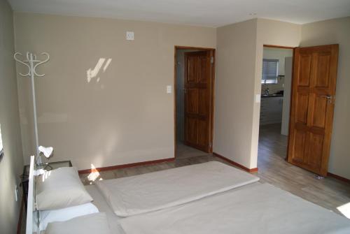 Klein Paradijs Country Retreatにあるベッド