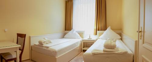 Katil atau katil-katil dalam bilik di Ringhotel Fährhaus