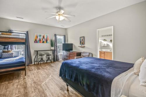 a bedroom with a bed and a desk at Alohalani at Surfside Beach in Myrtle Beach