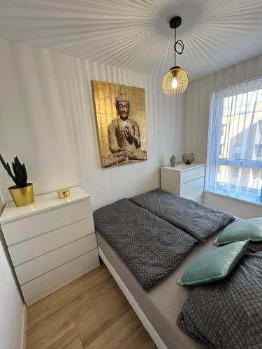 Postel nebo postele na pokoji v ubytování Cozy 1-Bedroom Condo