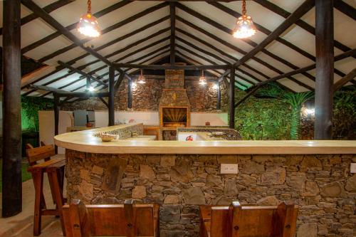 an outdoor bar in a stone building with lights at Playa El YAQUE Posada Yaque Sol, Isla de Margarita in El Yaque