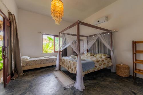 Ένα ή περισσότερα κρεβάτια σε δωμάτιο στο Villa Praiana Pousada 35knots Brasil