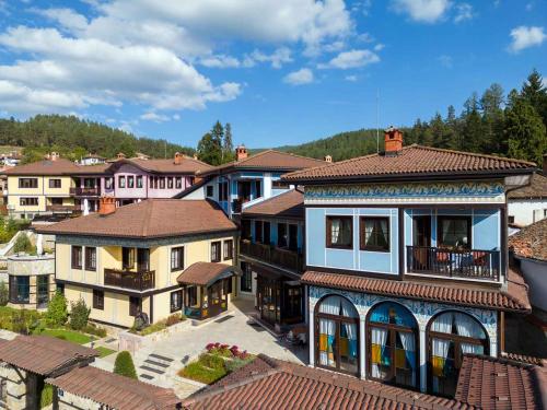 an aerial view of a town with houses at Armaco Residence in Koprivshtitsa