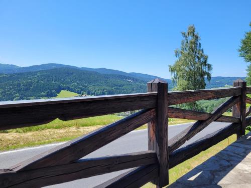 a wooden fence on the side of a road at Berry in Klatovy