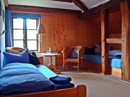 a bedroom with a bed and a bunk bed at Alte Ausspanne in Walkendorf