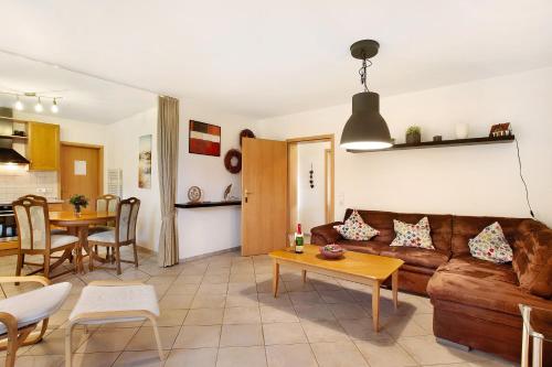 a living room with a couch and a table at Ferienwohnung Rotdorn in Schmallenberg